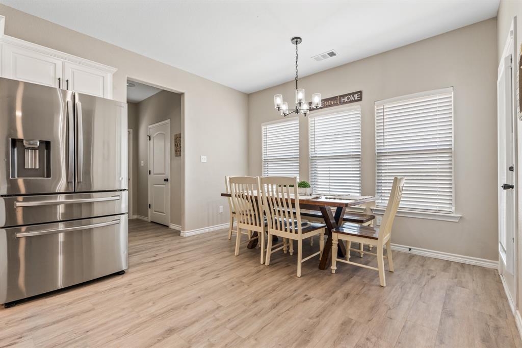 130 Private Road Hillsboro, TX 76645 - Photo 12 of 39 a dining room with furniture and wooden floor