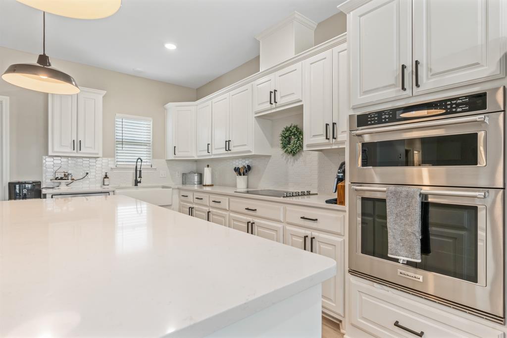 130 Private Road Hillsboro, TX 76645 - Photo 14 of 39 a kitchen with granite countertop white cabinets white stainless steel appliances and a sink