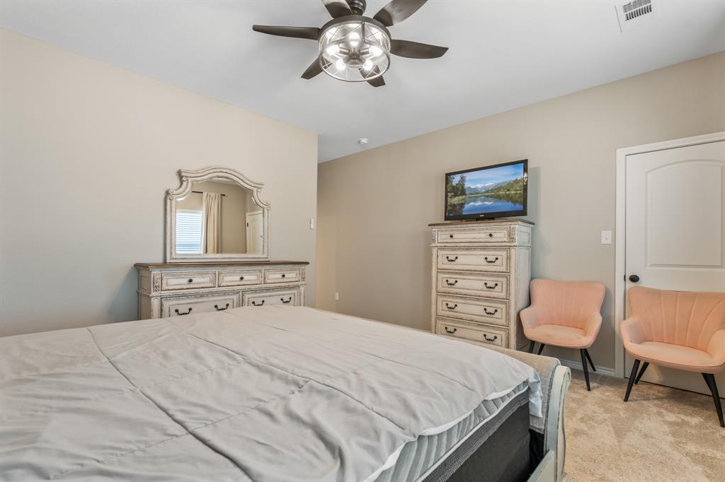 130 Private Road Hillsboro, TX 76645 - Photo 18 of 39 a bedroom with a bed and furniture