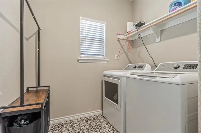 a bathroom with a granite countertop sink mirror vanity and toilet