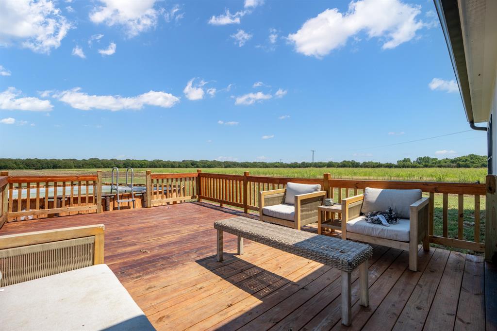 130 Private Road Hillsboro, TX 76645 - Photo 31 of 39 a view of a terrace with wooden floor and lake view