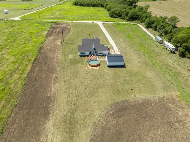 a view of a garden with an ocean