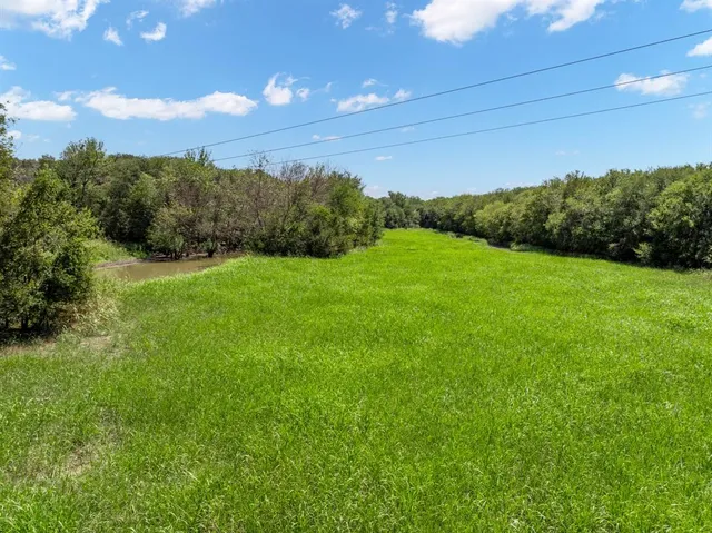 a view of a house with pool and chairs