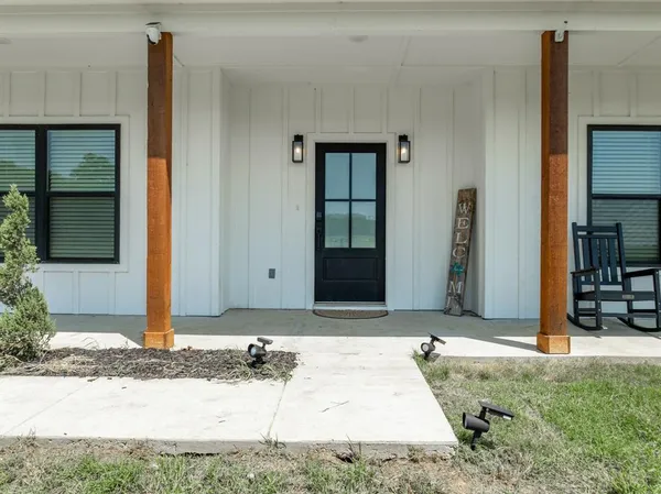 a view of entryway with wooden floor