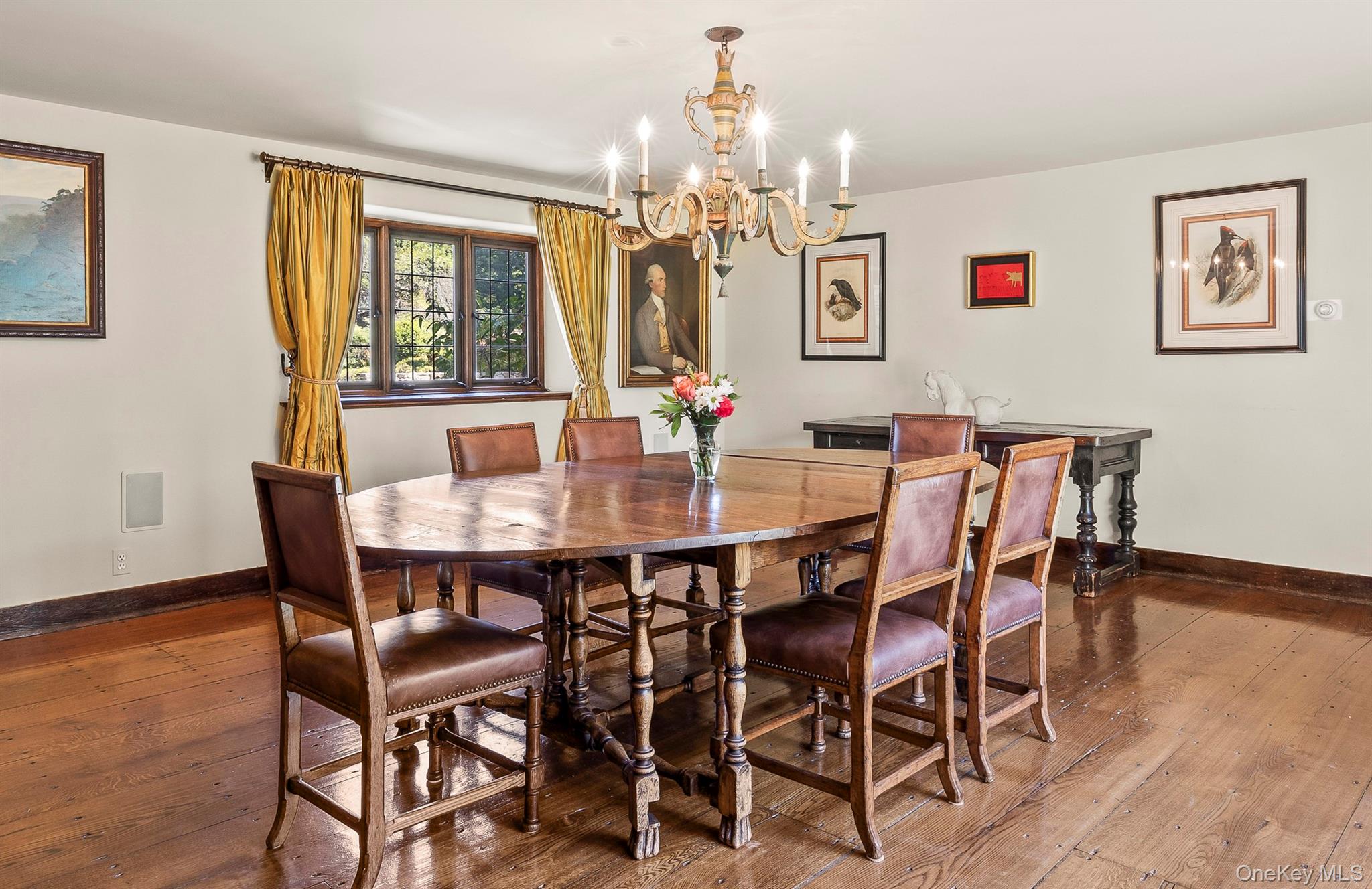 99 Quaker Bridge Road Croton-on-Hudson, NY 10520 - Photo 14 of 50 a view of a dining room with furniture and chandelier