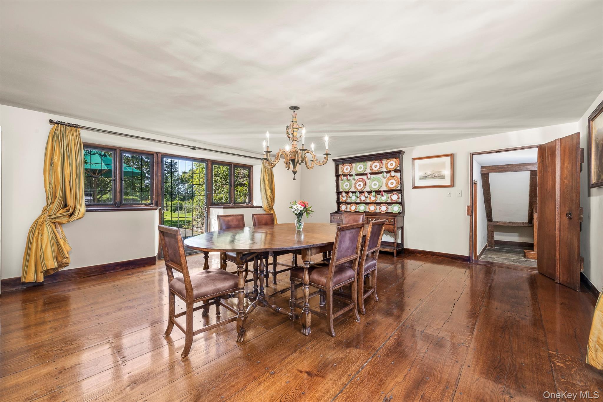 99 Quaker Bridge Road Croton-on-Hudson, NY 10520 - Photo 15 of 50 a view of a dining room with furniture window and wooden floor