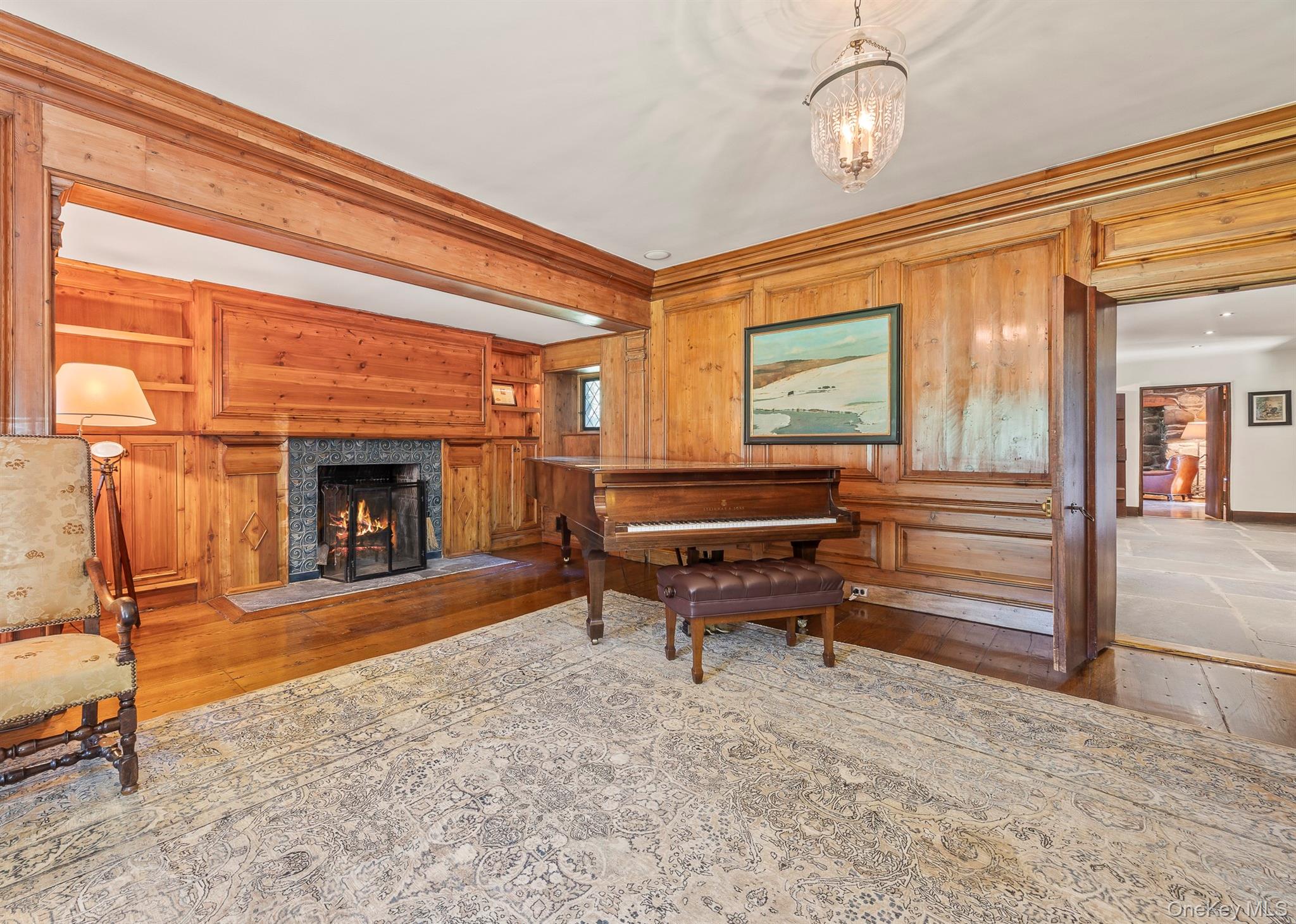 99 Quaker Bridge Road Croton-on-Hudson, NY 10520 - Photo 20 of 50 a backyard of a house with fireplace outdoor seating and outdoor space