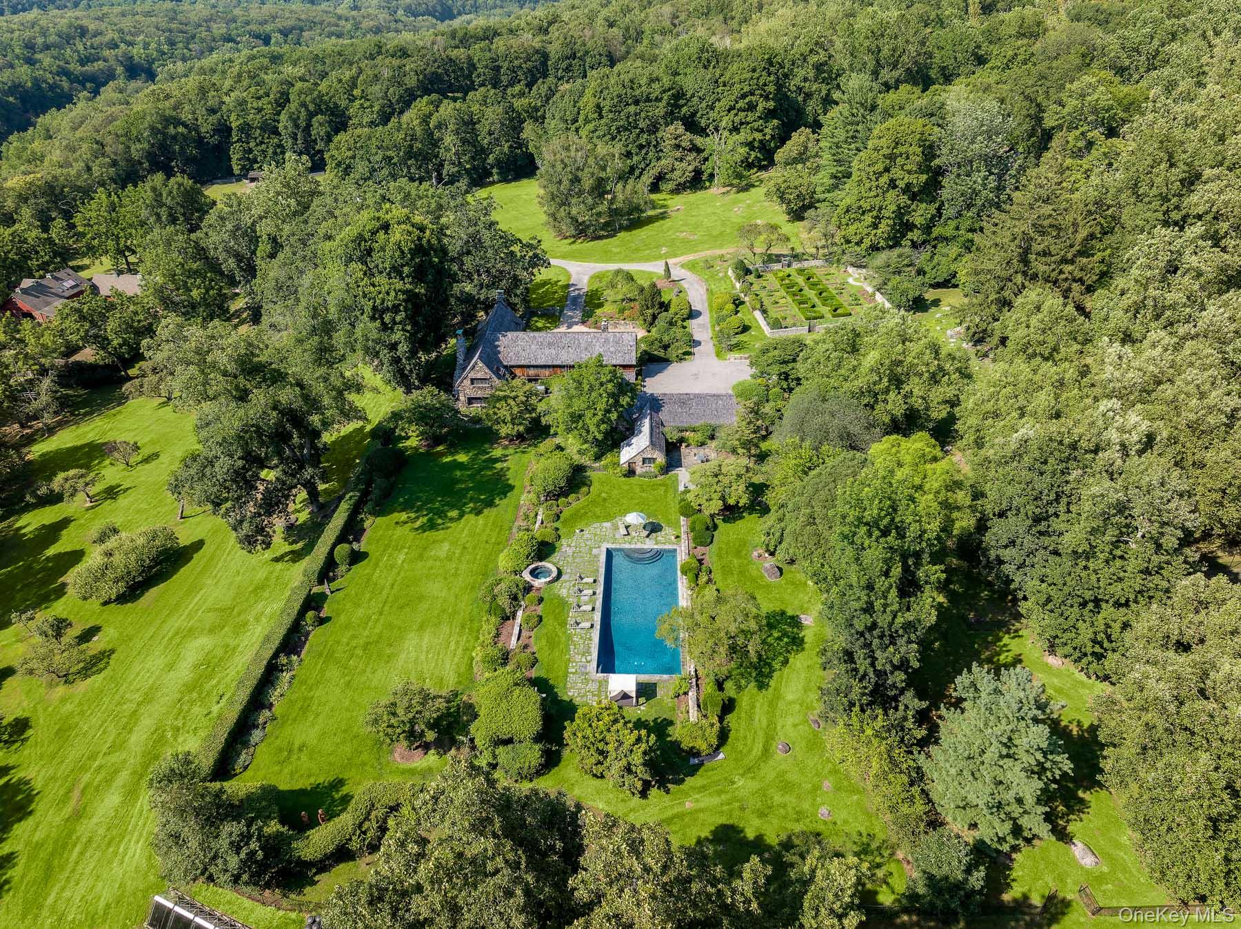 99 Quaker Bridge Road Croton-on-Hudson, NY 10520 - Photo 2 of 50 an aerial view of residential house with an outdoor space