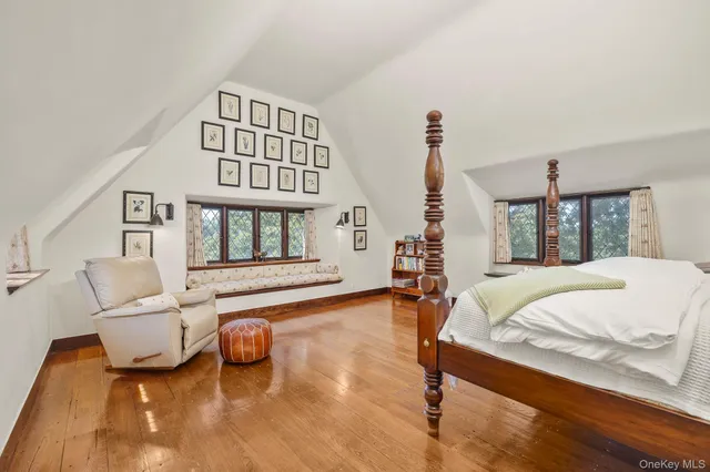 a bedroom with furniture and a window