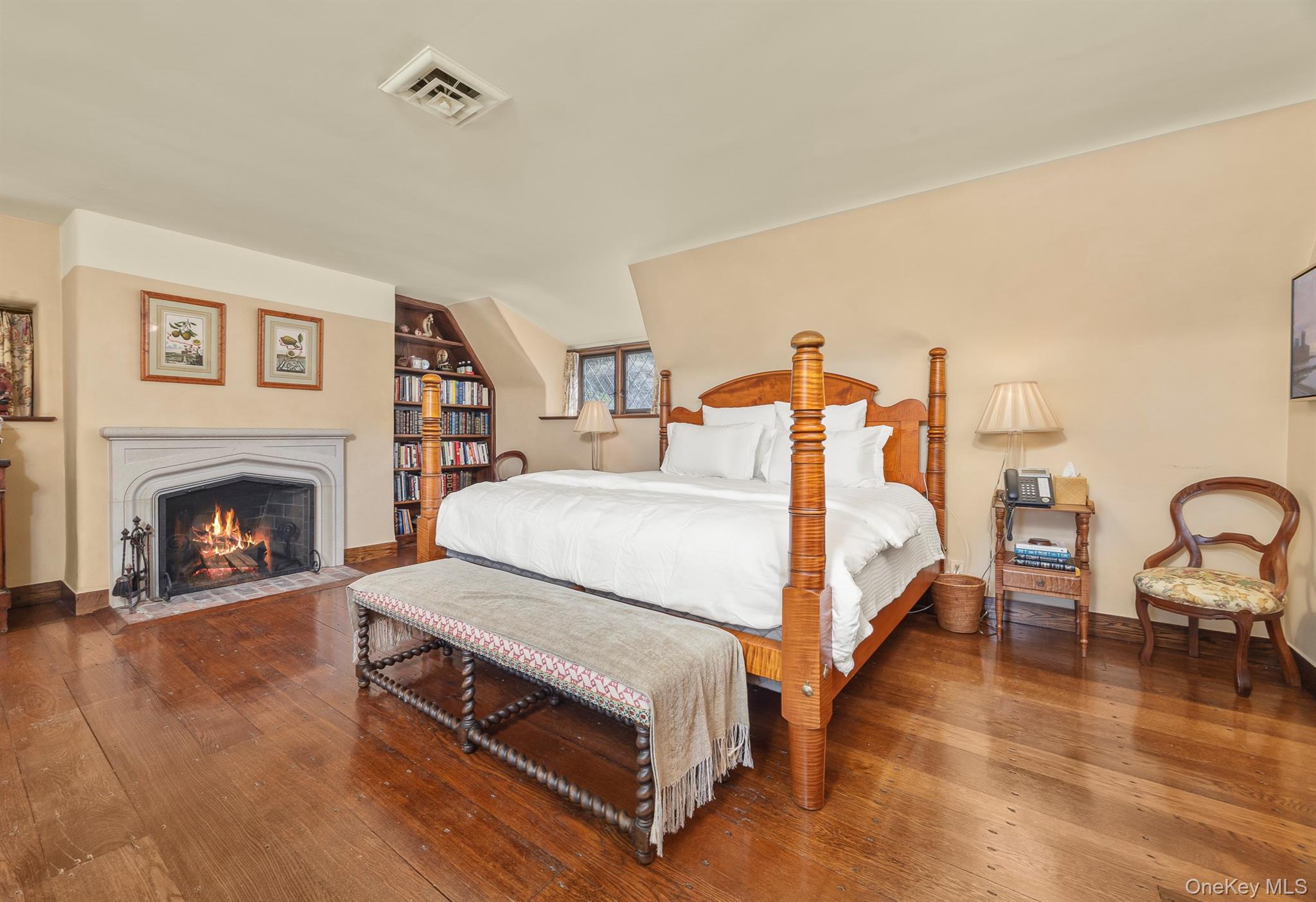 99 Quaker Bridge Road Croton-on-Hudson, NY 10520 - Photo 25 of 50 a spacious bedroom with a bed and a fireplace