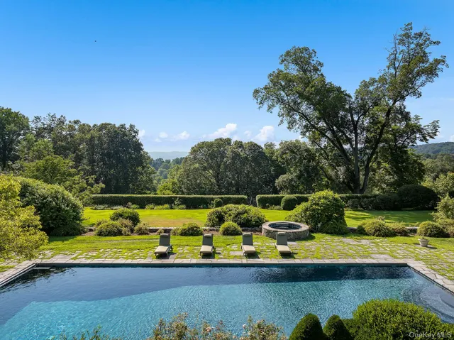 a view of a lake with a house in the background