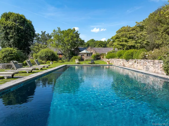 a view of a lake with boats and trees in the background