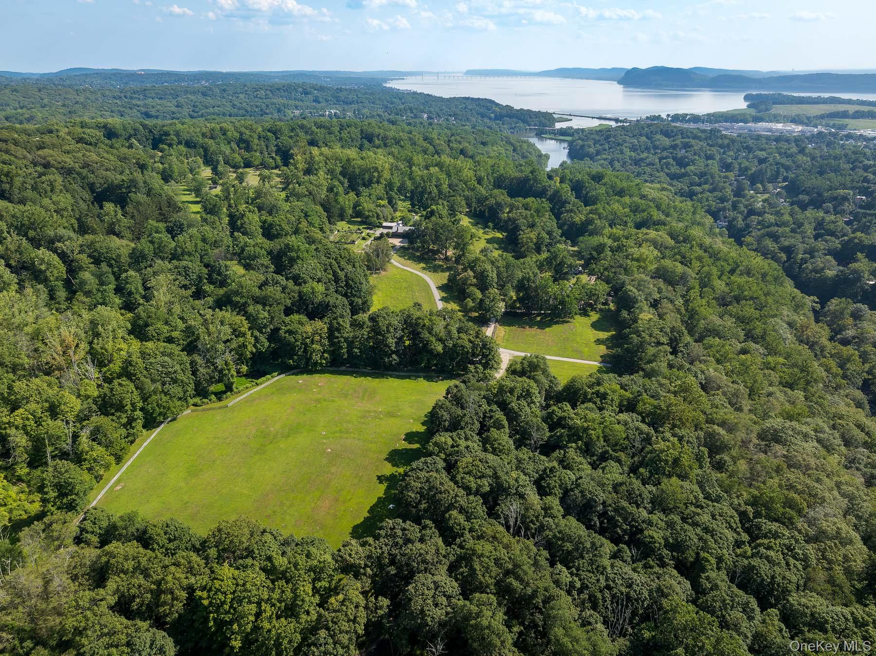 99 Quaker Bridge Road Croton-on-Hudson, NY 10520 - Photo 4 of 50 a view of a lake with mountains in the background