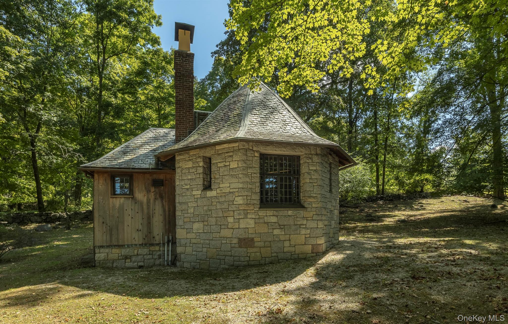 99 Quaker Bridge Road Croton-on-Hudson, NY 10520 - Photo 41 of 50 a front view of a house with garden