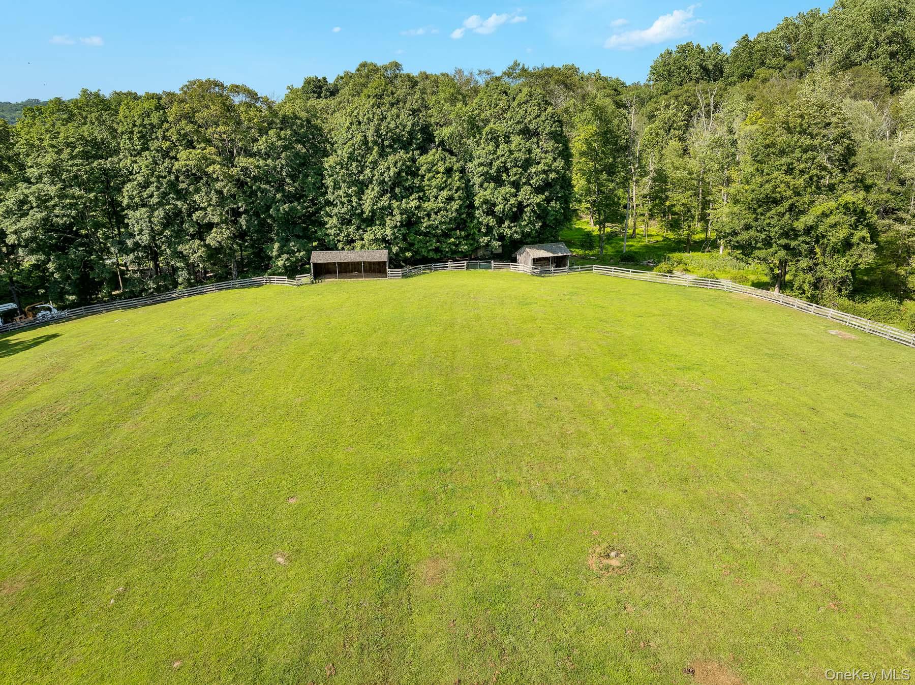 99 Quaker Bridge Road Croton-on-Hudson, NY 10520 - Photo 44 of 50 a view of yard with swimming pool and outdoor seating