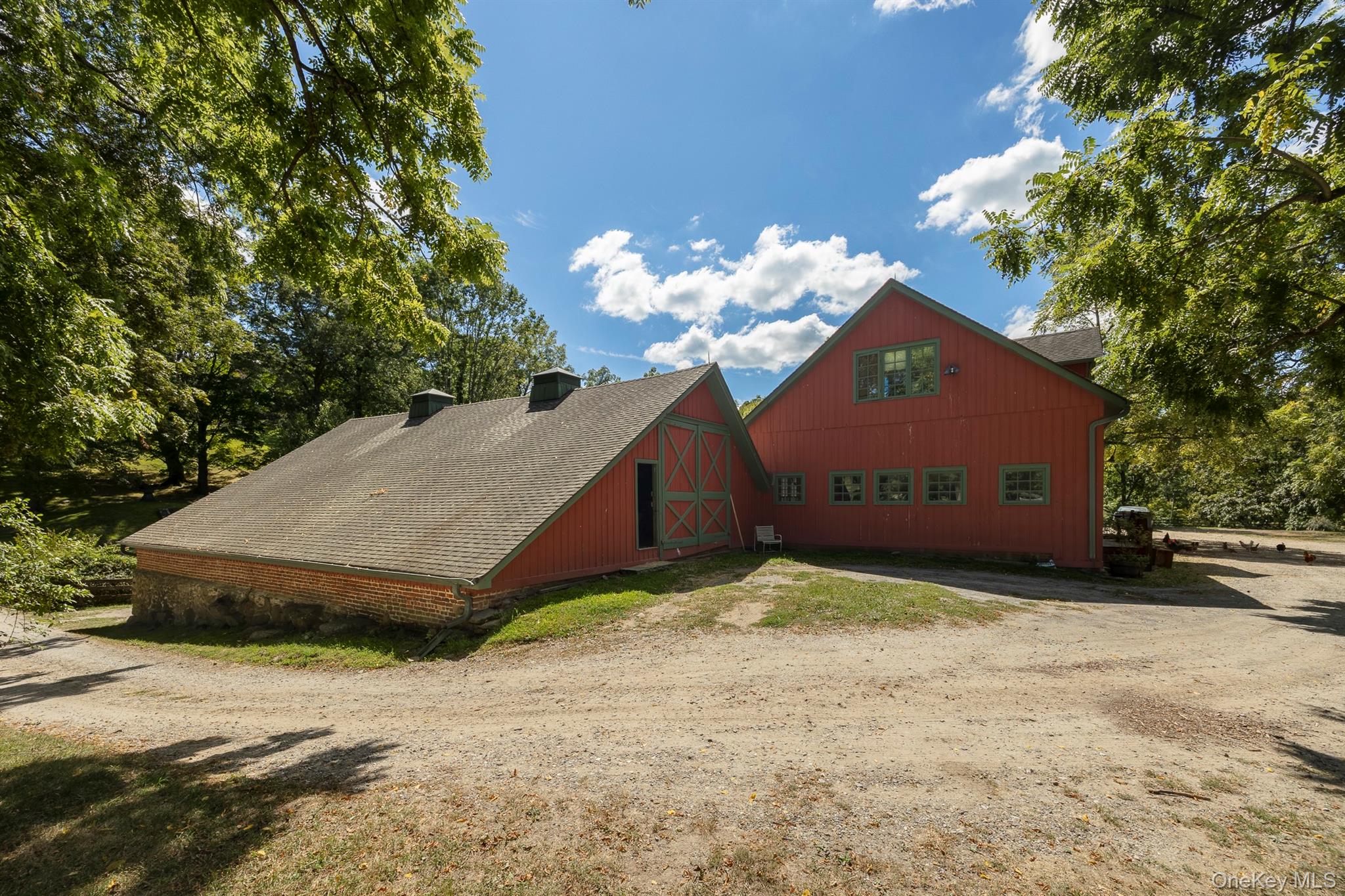 99 Quaker Bridge Road Croton-on-Hudson, NY 10520 - Photo 48 of 50 a view of a house with a yard