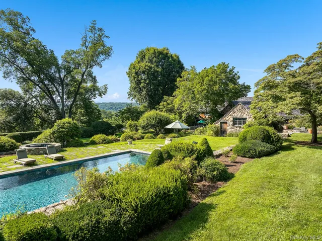 a view of yard with outdoor seating and lake view
