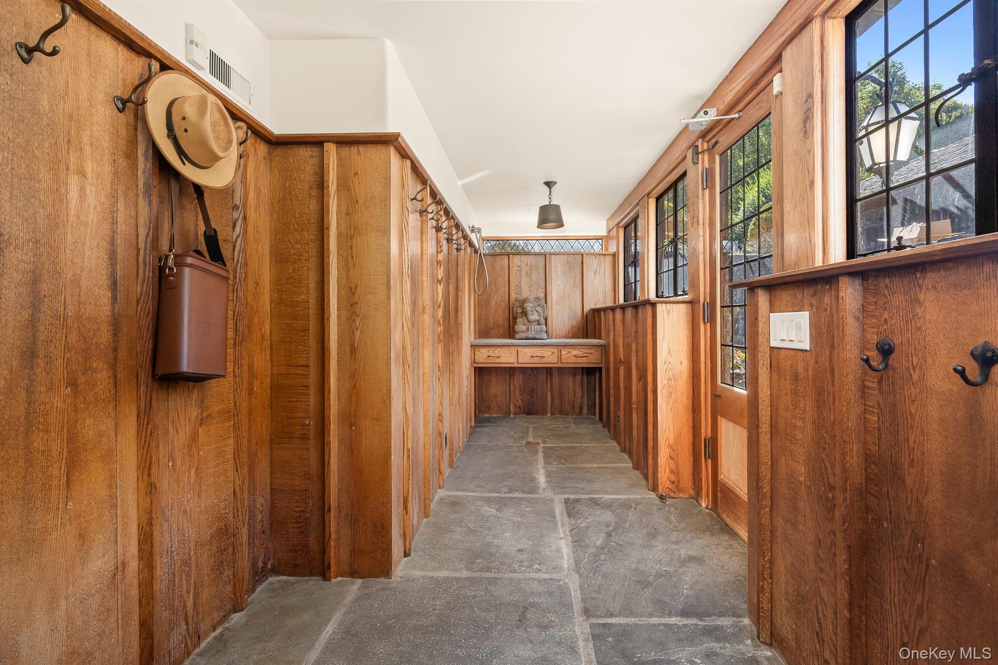 99 Quaker Bridge Road Croton-on-Hudson, NY 10520 - Photo 10 of 50 a view of a hallway with wooden door and stairs