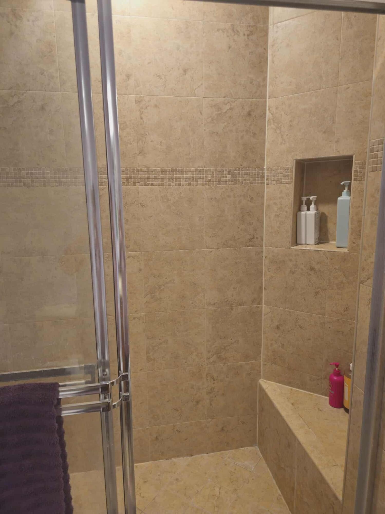 9770 Bowline Drive, Unit 102 West Palm Beach, FL 33411 - Photo 11 of 27 a bathroom with a bathtub