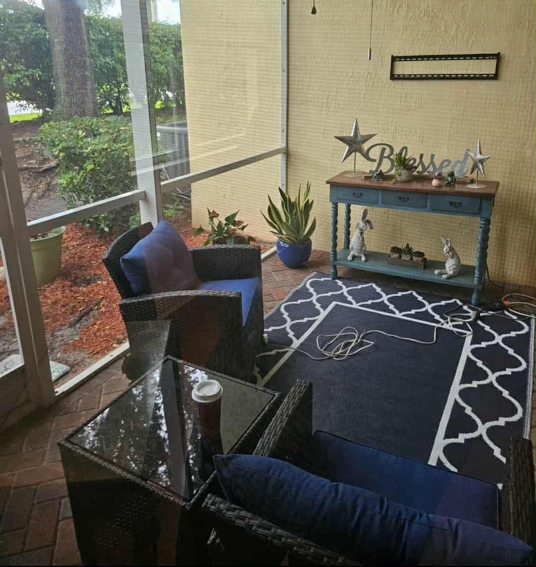 9770 Bowline Drive, Unit 102 West Palm Beach, FL 33411 - Photo 14 of 27 a living room with furniture and a window