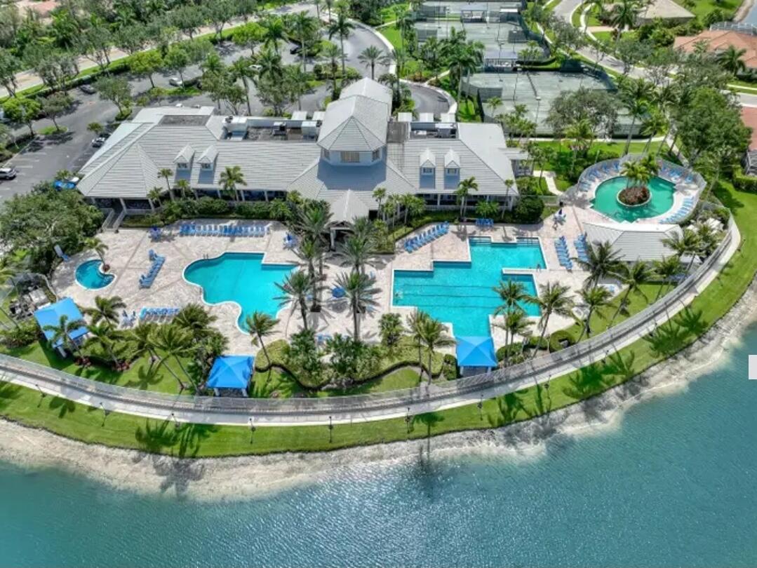 9770 Bowline Drive, Unit 102 West Palm Beach, FL 33411 - Photo 23 of 27 an aerial view of a house with a garden and lake view