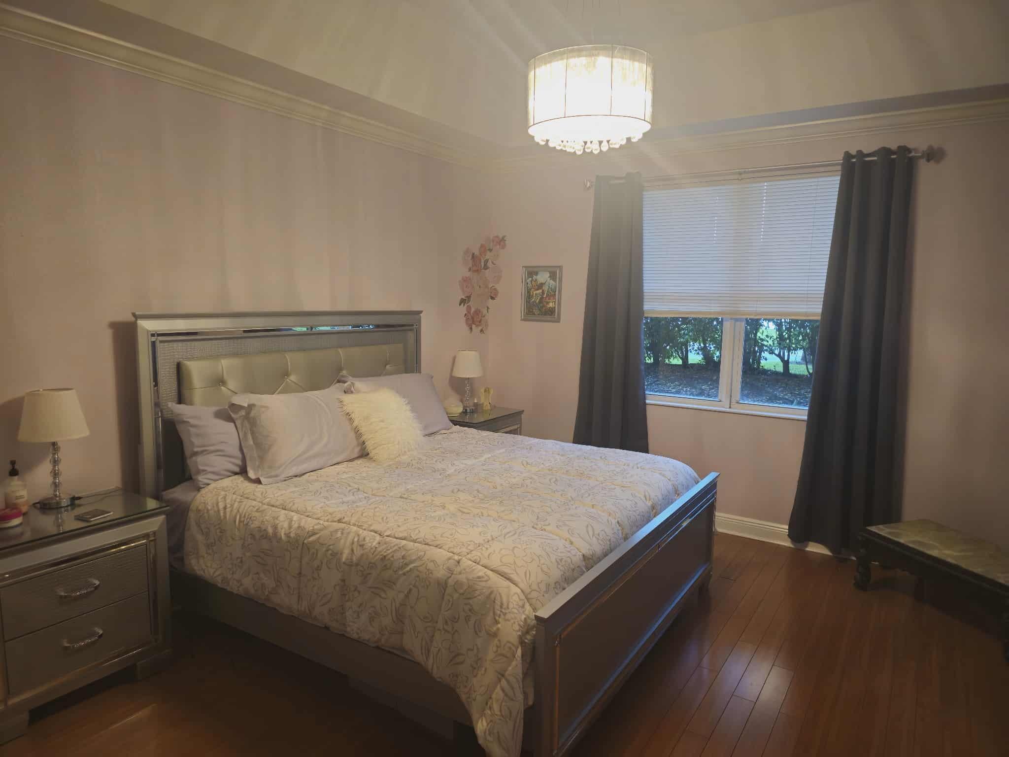 9770 Bowline Drive, Unit 102 West Palm Beach, FL 33411 - Photo 9 of 27 a bedroom with a bed and a window