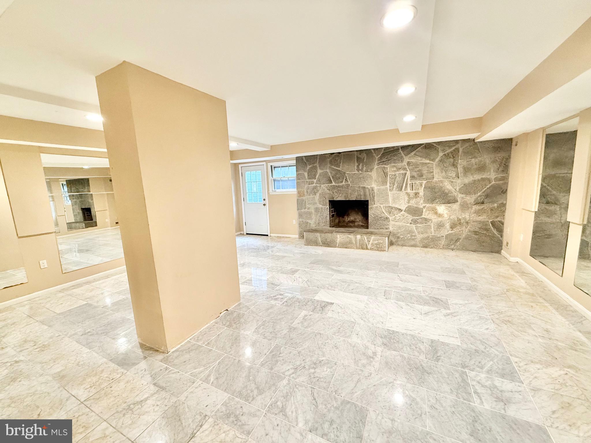 5439 Richenbacher Avenue Alexandria, VA 22304 - Photo 21 of 23 a view of empty room with a fireplace