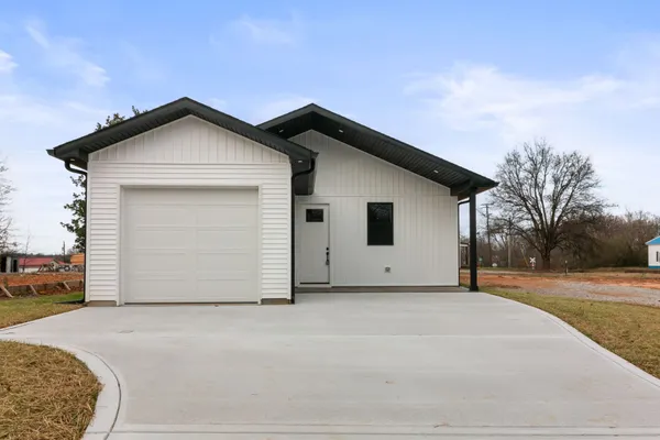 a view of garage and yard