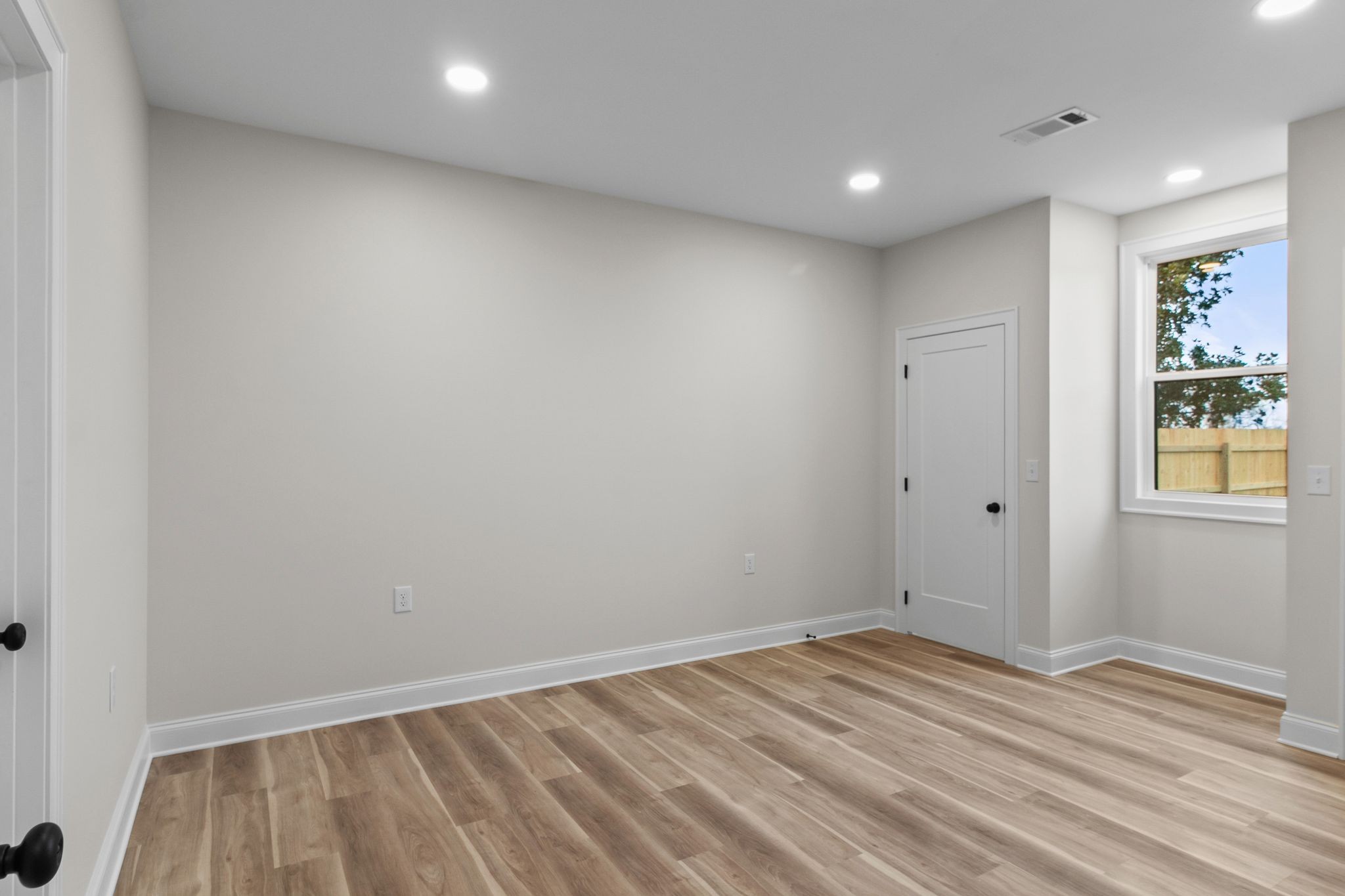 14 Warren Street Paris, TN 38242 - Photo 13 of 27 a view of room with wooden floor and window