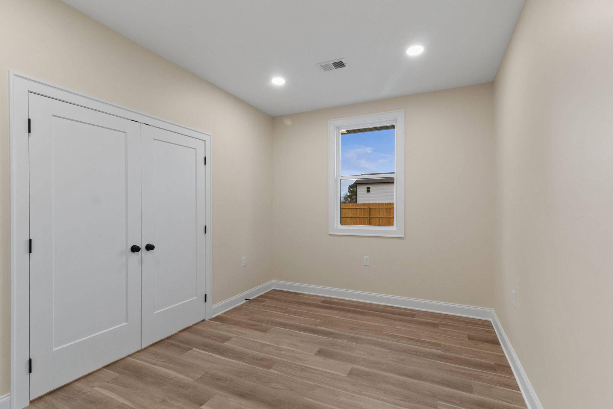 14 Warren Street Paris, TN 38242 - Photo 18 of 27 a view of an empty room with wooden floor
