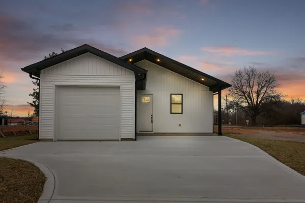 a front view of a house with a garage