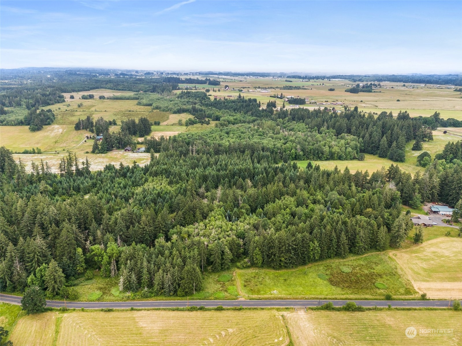 0 Howe Road Toledo, WA 98591 - Photo 1 of 16 an aerial view of residential houses with outdoor space and swimming pool