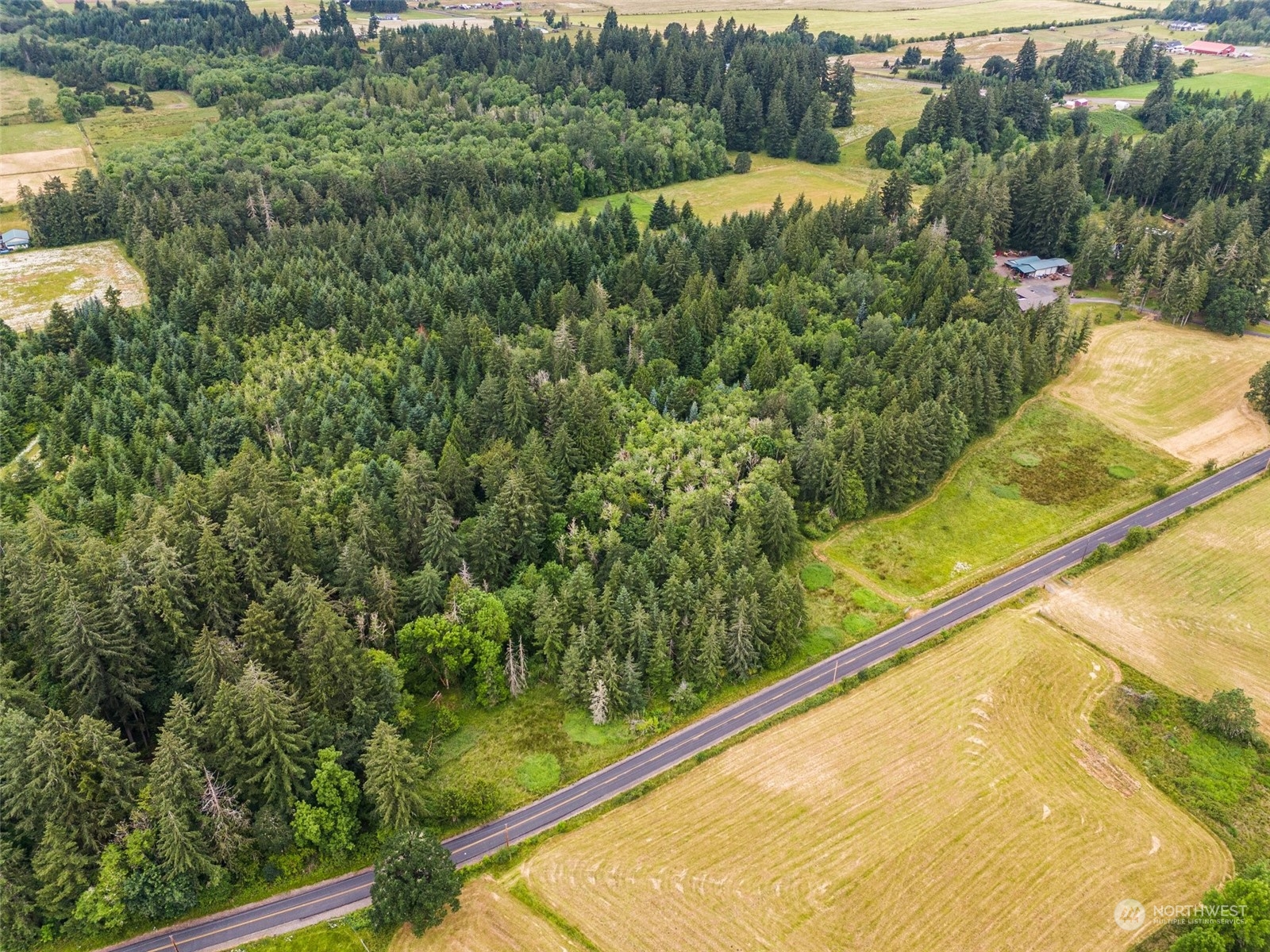 0 Howe Road Toledo, WA 98591 - Photo 2 of 16 a view of a yard with a wooden fence