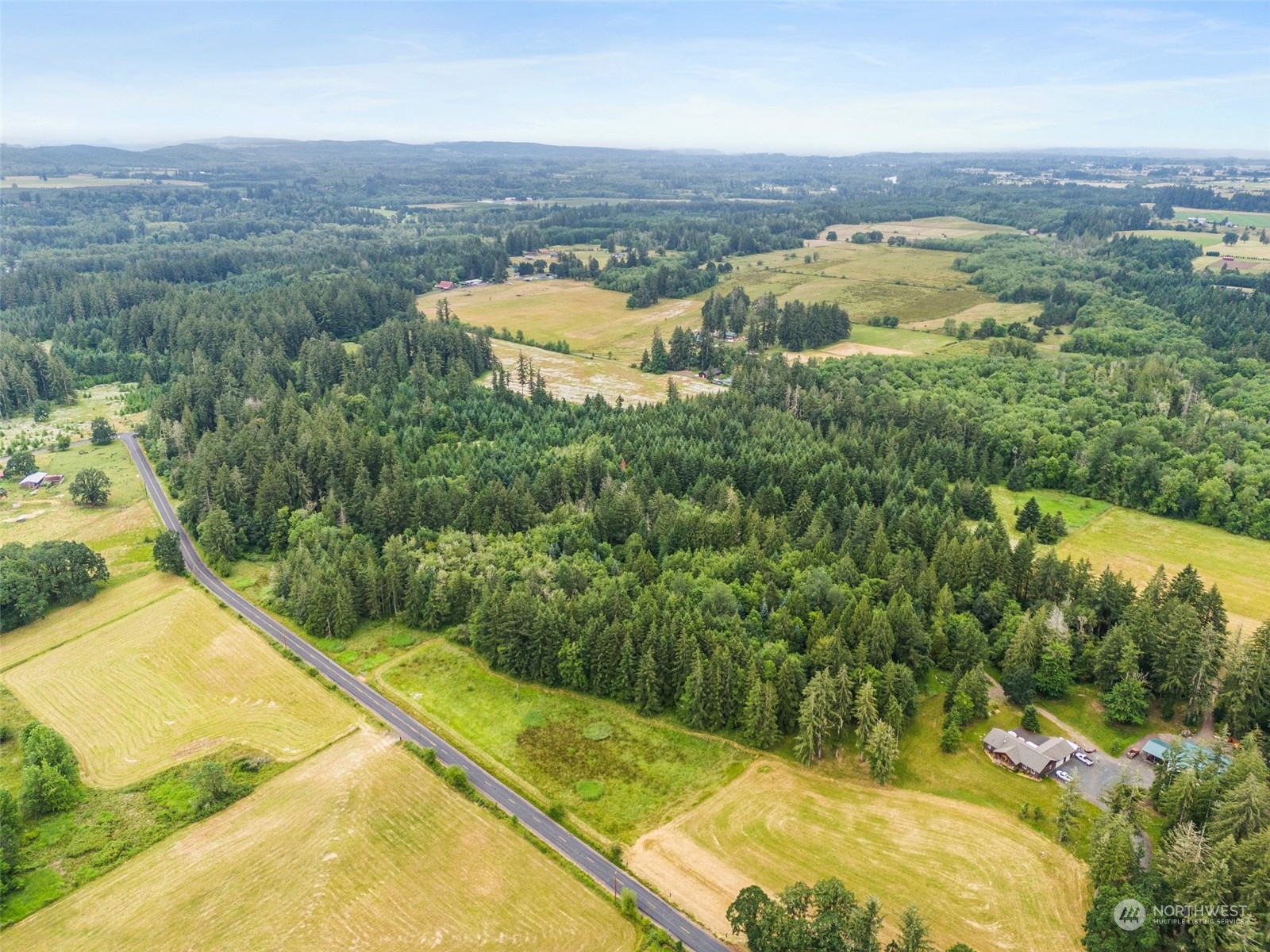 0 Howe Road Toledo, WA 98591 - Photo 3 of 16 an aerial view of residential houses with outdoor space and swimming pool