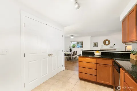 a kitchen with cabinets appliances and a counter