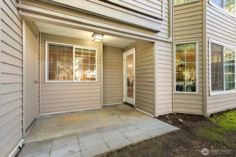 a view of a house with white door and a window
