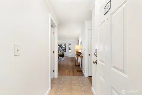 a view of a hallway with a livingroom and dining room view