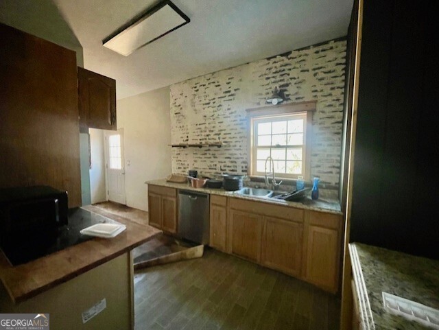 6070 Riggins Mill Road Dry Branch, GA 31020 - Photo 11 of 19 a kitchen with a sink and cabinets
