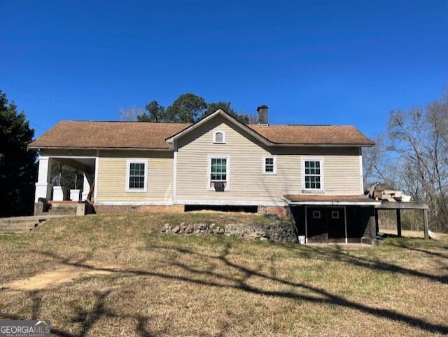 6070 Riggins Mill Road Dry Branch, GA 31020 - Photo 16 of 19 a view of a house with a patio