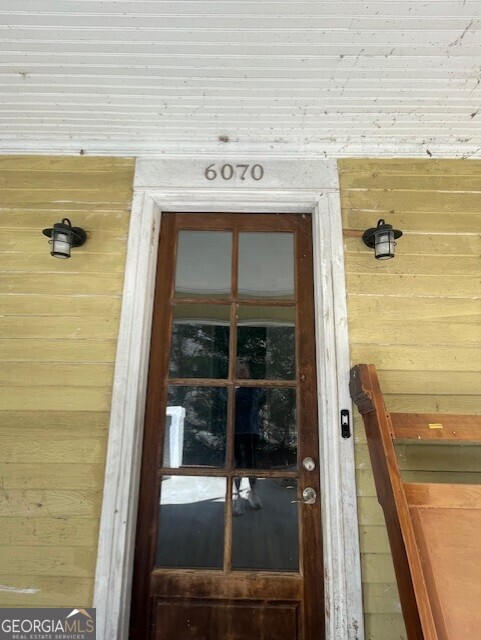 6070 Riggins Mill Road Dry Branch, GA 31020 - Photo 2 of 19 a view of a glass door with a shower