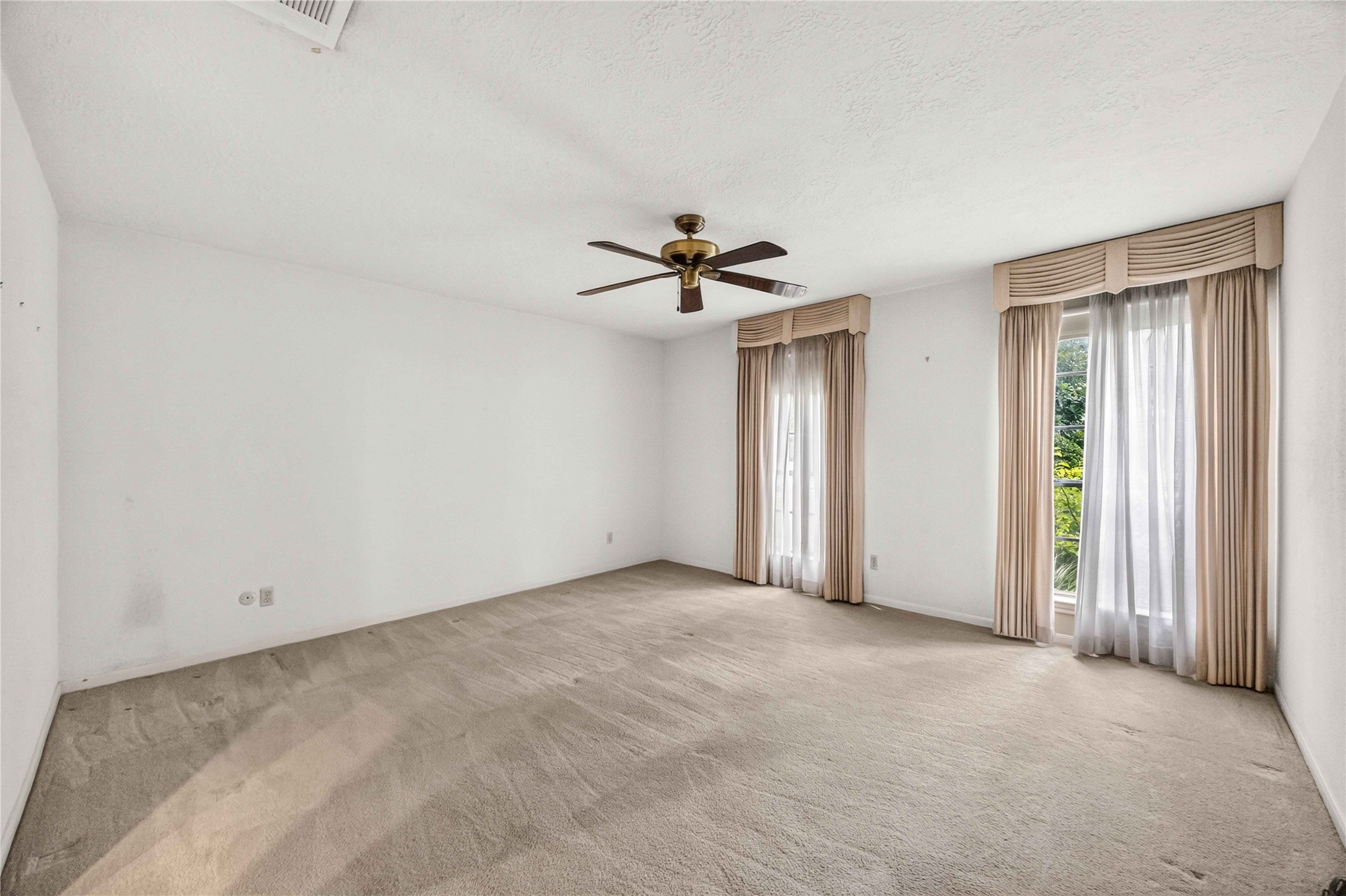 6302 Meadowtrace Drive Spring, TX 77389 - Photo 16 of 35 First-floor primary bedroom offers generous space, natural light and room for a sitting area.