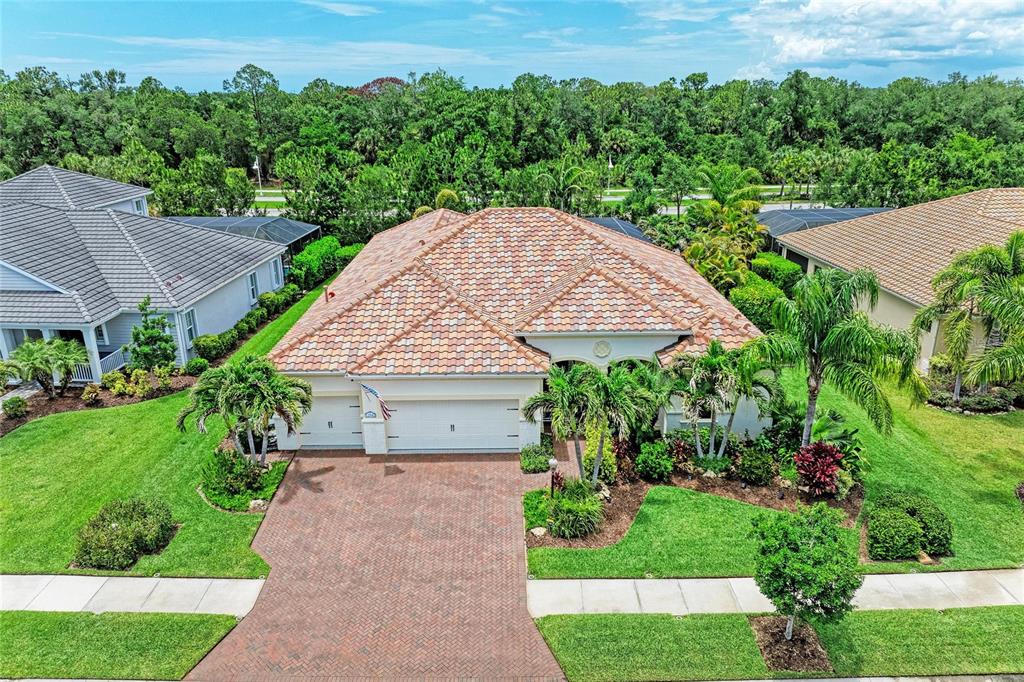 12642 Harney Street Venice, FL 34293 - Photo 3 of 85 an aerial view of a house with yard and green space