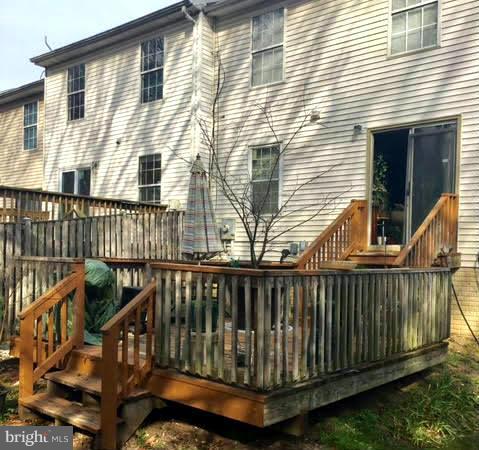 8631 Ritchboro Road District Heights, MD 20747 - Photo 1 of 11 a view of a wooden house with a wooden fence