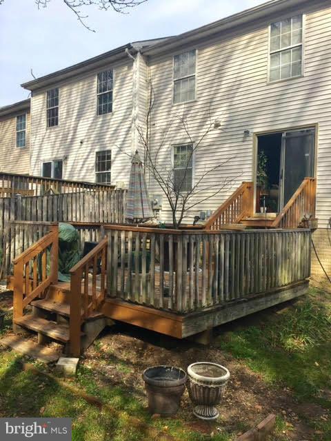 8631 Ritchboro Road District Heights, MD 20747 - Photo 8 of 11 a balcony with wooden floor and outdoor seating