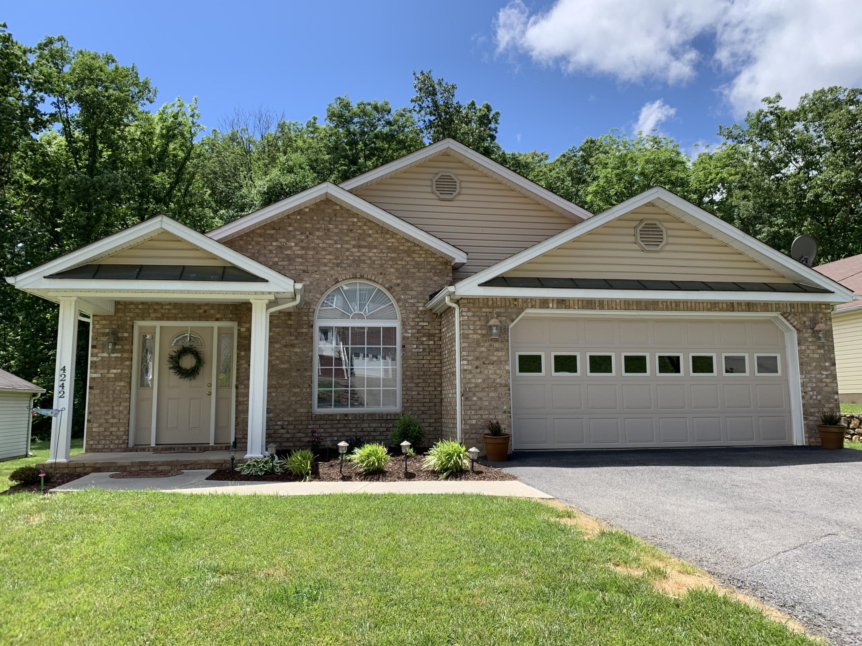 4242 Daugherty Road Salem, VA 24153 - Photo 1 of 40 a front view of a house with a yard and garage