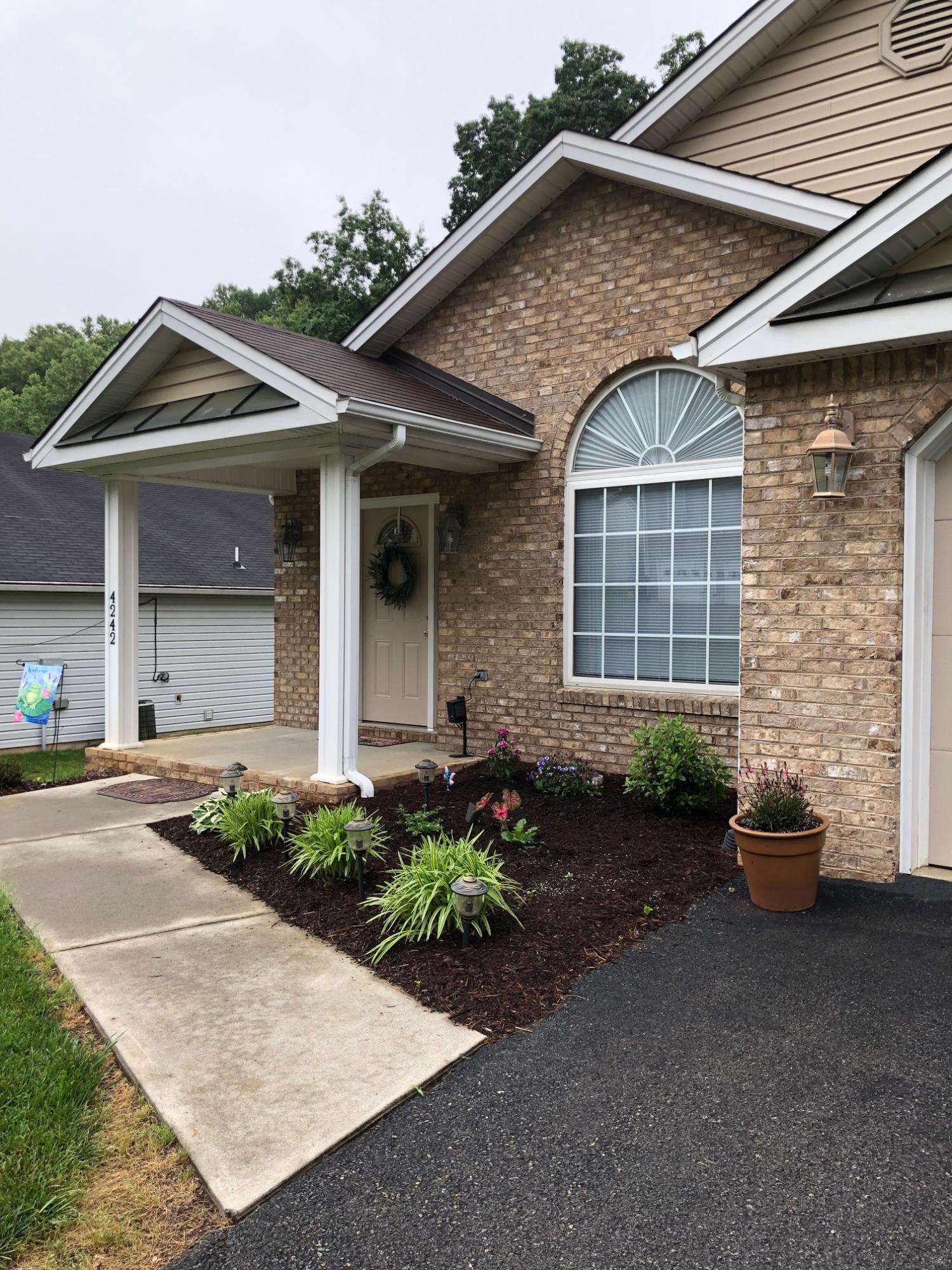 4242 Daugherty Road Salem, VA 24153 - Photo 2 of 40 a front view of a house with a yard and garage