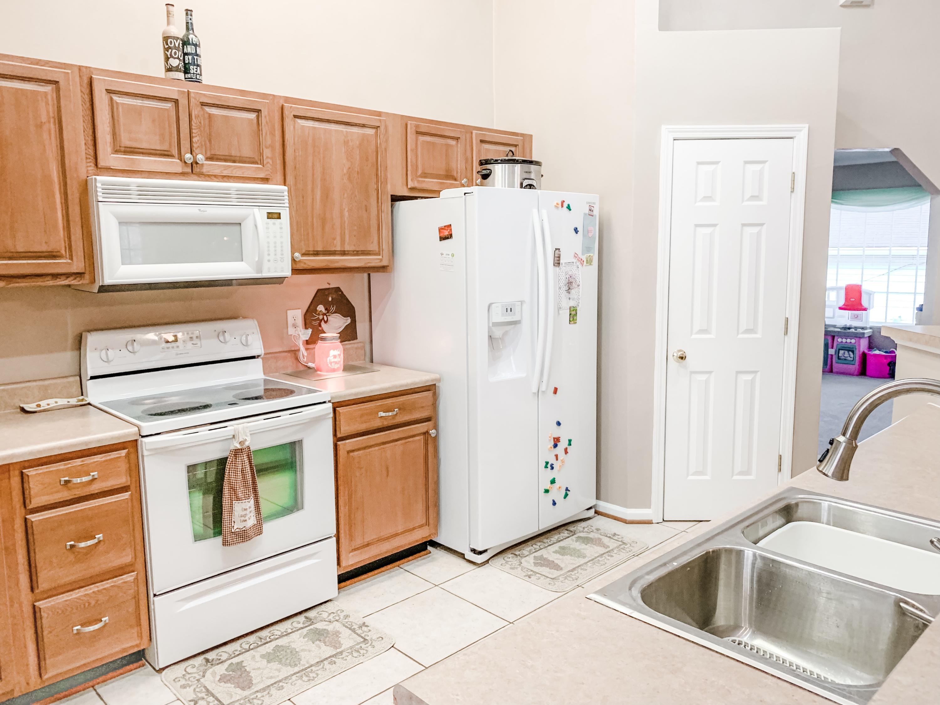 4242 Daugherty Road Salem, VA 24153 - Photo 14 of 40 a kitchen with stainless steel appliances granite countertop a sink a stove a refrigerator a washer and dryer