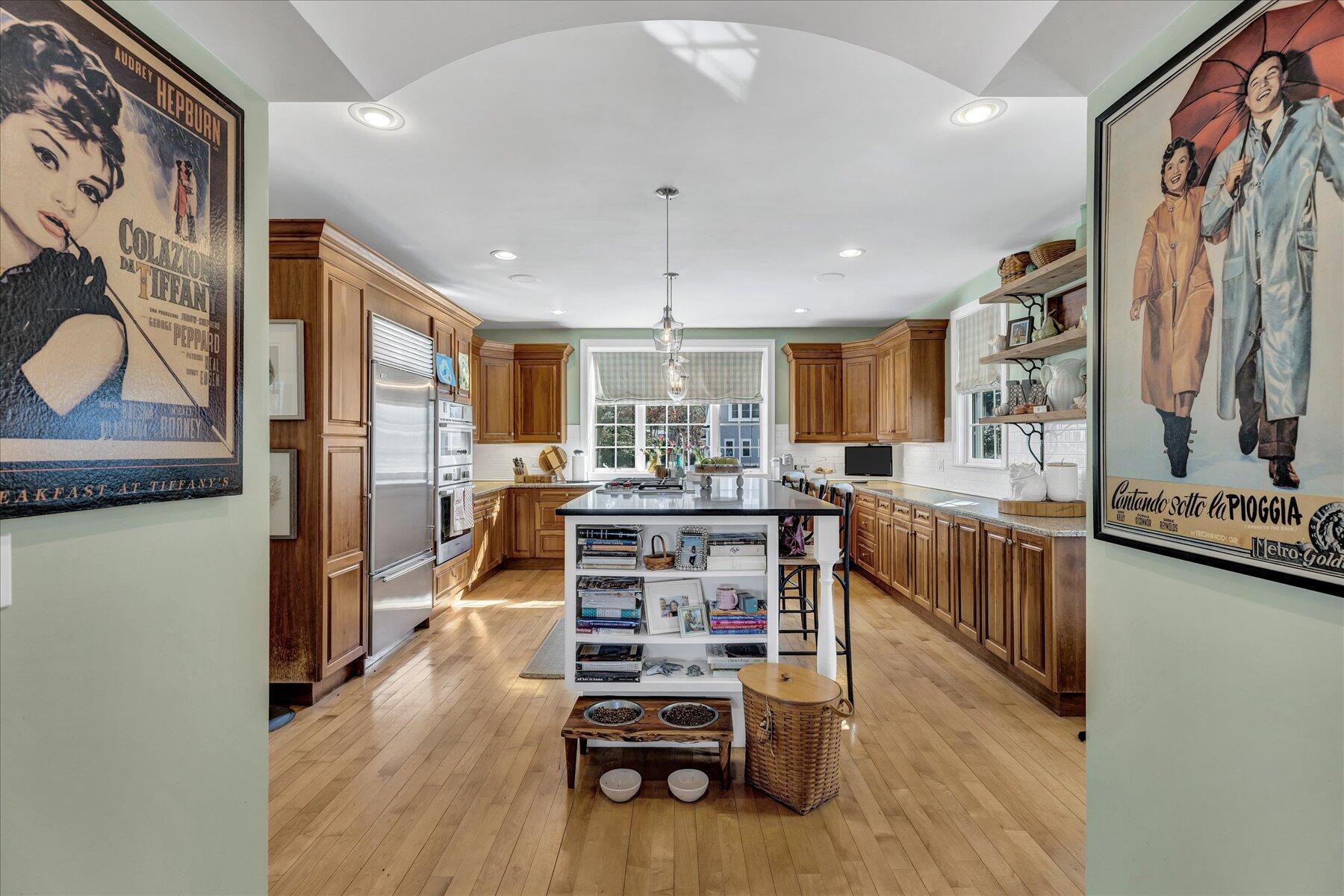 77 The Heights Mashpee, MA 02649 - Photo 15 of 52 a kitchen with stainless steel appliances wooden floor and refrigerator
