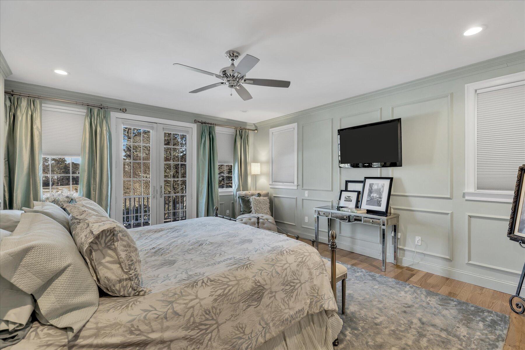 77 The Heights Mashpee, MA 02649 - Photo 21 of 52 a bedroom with a bed and a flat screen tv
