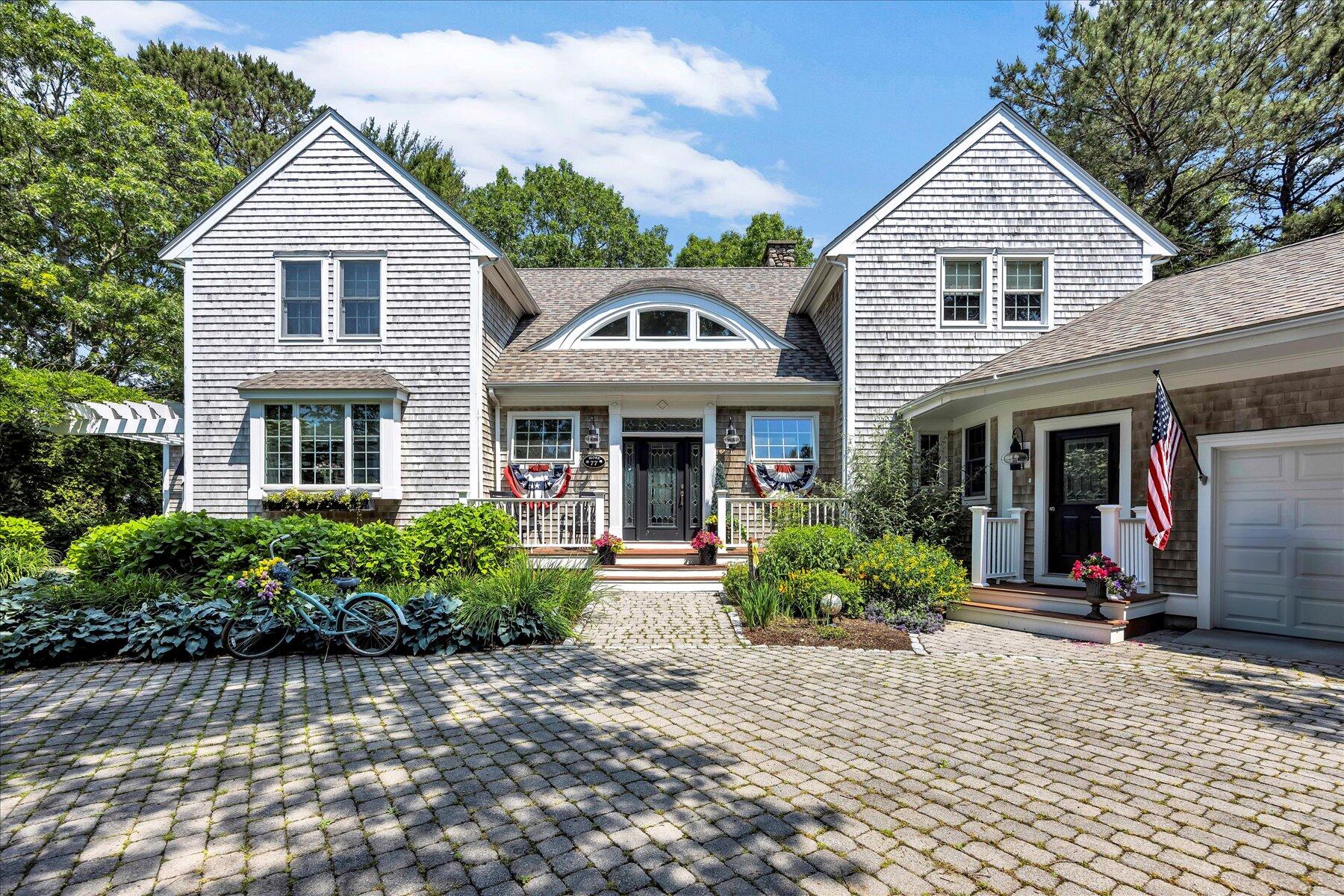 77 The Heights Mashpee, MA 02649 - Photo 3 of 52 front view of a house with a yard